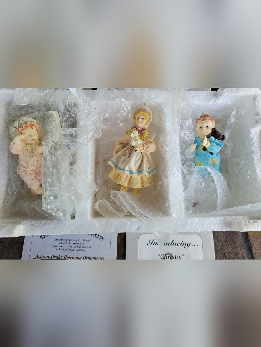 Porcelain Figurine Trio in Pink, Cream, and Blue